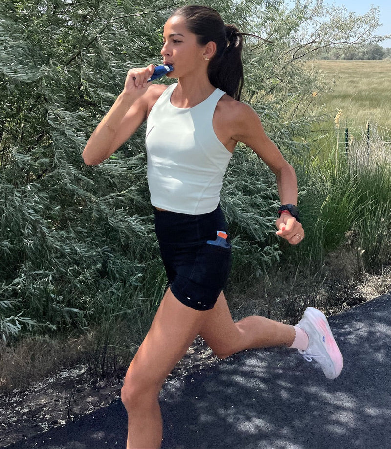 A runner using a UCAN energy gel.